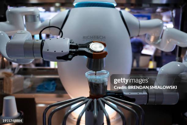 An Adam robot from Richtech Robotics makes coffee at the Las Vegas Convention Center during the Consumer Electronics Show January 10 in Las Vegas,...