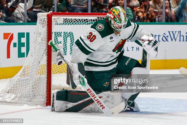 Minnesota Wild goaltender Jesper Wallstedt gets up after missing the puck for a goal during the game between the Dallas Stars and the Minnesota Wild...