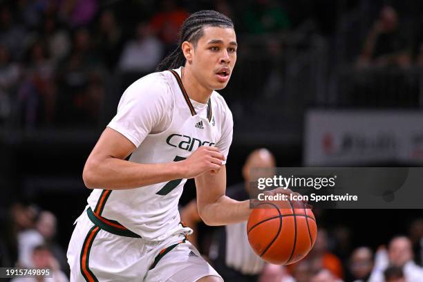 Miami guard Kyshawn George handles the ball in the first half as the Miami Hurricanes faced the Louisville Cardinals on January 10 at the Watsco...