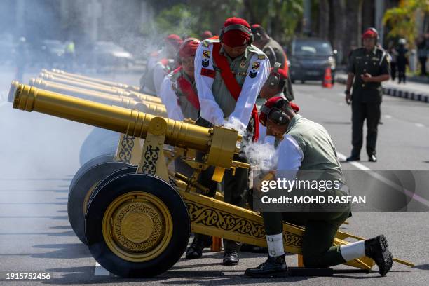 Royal Brunei's Military Police fire gun salutes after Prince Abdul Mateen's solemnization as part of the royal wedding at Sultan Omar Ali Saifuddien...