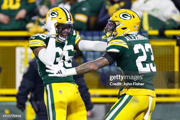 Anthony Johnson Jr. #36 and Jaire Alexander of the Green Bay Packers reacts after a play during the second half in the game against the Chicago Bears...
