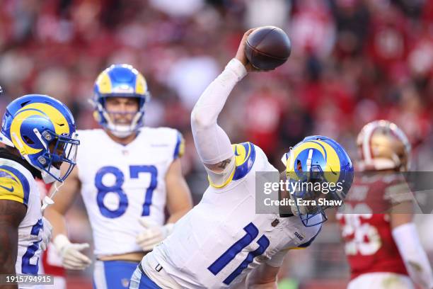 Carson Wentz of the Los Angeles Rams celebrates after a rushing touchdown in the fourth quarter against the San Francisco 49ers at Levi's Stadium on...