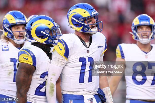 Carson Wentz of the Los Angeles Rams celebrates after a rushing touchdown in the fourth quarter against the San Francisco 49ers at Levi's Stadium on...