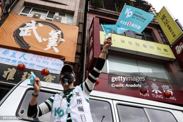 Supporter of Taiwan People's party waves TPP flags as daily life continues ahead of general election in Taipei, Taiwan on January 9, 2024. Voters...