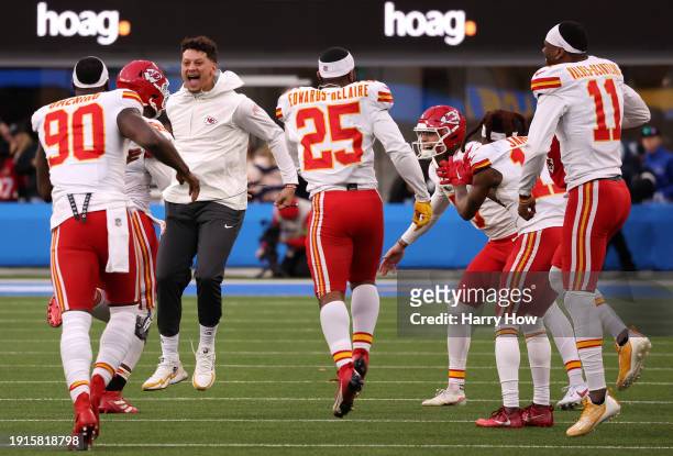 Chris Jones of the Kansas City Chiefs, celebrates after a sack with teammates Charles Omenihu, Clyde Edwards-Helaire, Richie James, Marquez...
