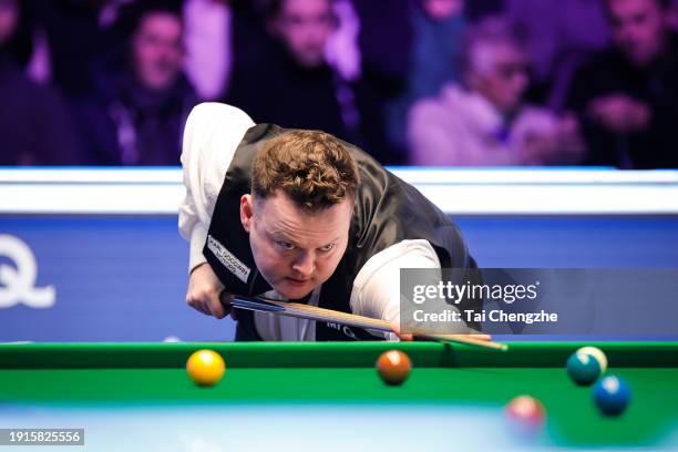 Shaun Murphy of England plays a shot in the first round match against Zhang Anda of China on day 1 of the 2024 MrQ Masters Snooker at Alexandra...