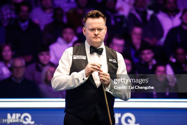 Shaun Murphy of England reacts in the first round match against Zhang Anda of China on day 1 of the 2024 MrQ Masters Snooker at Alexandra Palace on...