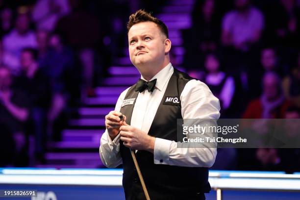 Shaun Murphy of England reacts in the first round match against Zhang Anda of China on day 1 of the 2024 MrQ Masters Snooker at Alexandra Palace on...
