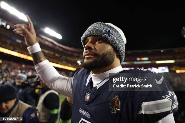 Dak Prescott of the Dallas Cowboys waves to fans after the game against the Washington Commanders at FedExField on January 07, 2024 in Landover,...