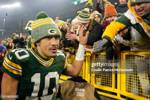 Jordan Love of the Green Bay Packers interacts with fans after a win over the Chicago Bears at Lambeau Field on January 07, 2024 in Green Bay,...