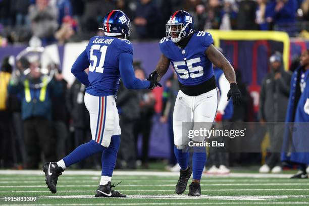 Azeez Ojulari of the New York Giants reacts after a play with Jihad Ward during the second half in the game against the Philadelphia Eagles at...