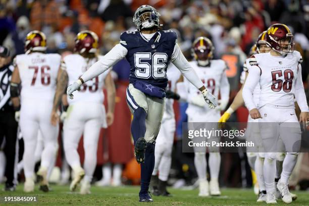 Dante Fowler Jr. #56 of the Dallas Cowboys reacts after a sack during the fourth quarter against the Washington Commanders at FedExField on January...