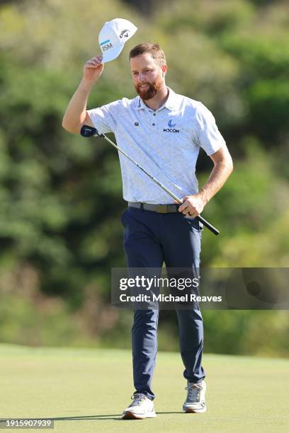 Chris Kirk of the United States celebrates after winning on the 18th green during the final round of The Sentry at Plantation Course at Kapalua Golf...