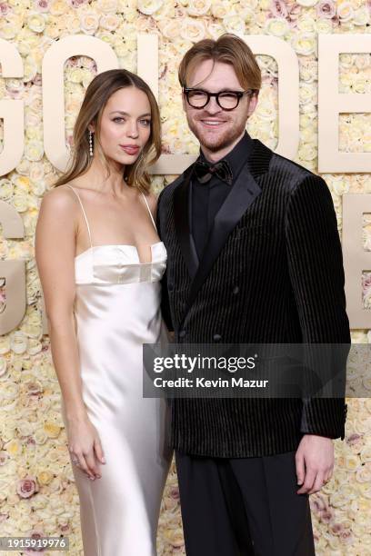 Claudia Sulewski and FINNEAS attend the 81st Annual Golden Globe Awards at The Beverly Hilton on January 07, 2024 in Beverly Hills, California.