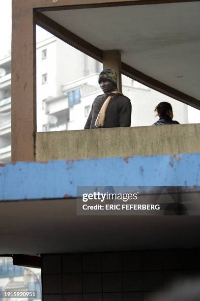 Young people stand next to the Maison Blanche association of the Bois du Temple housing project during a visit of Socialist presidential candidate...