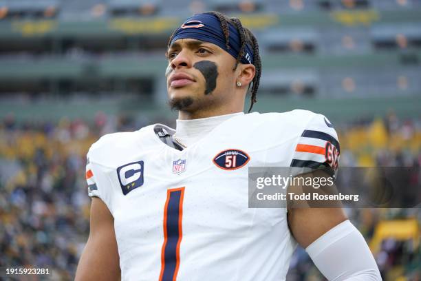 Quarterback Justin Fields of the Chicago Bears stretches prior to an NFL football game against the Green Bay Packers at Lambeau Field on January 7,...