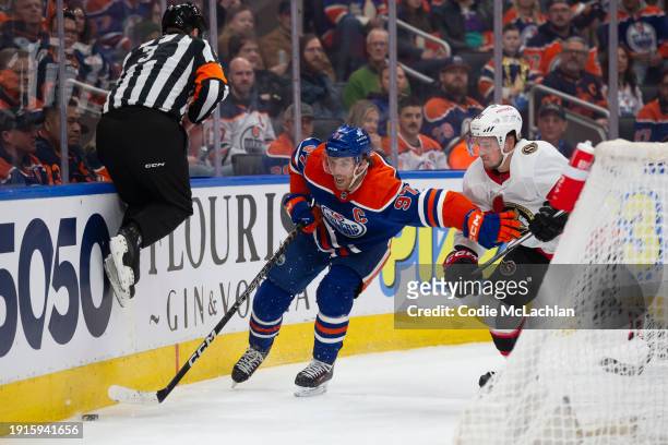 Connor McDavid of the Edmonton Oilers skates against Vladimir Tarasenko of the Ottawa Senators during the first period at Rogers Place on January 6,...