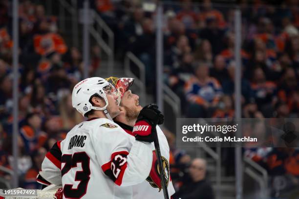 Travis Hamonic and goaltender Anton Forsberg of the Ottawa Senators skate against the Edmonton Oilers during the third period at Rogers Place on...