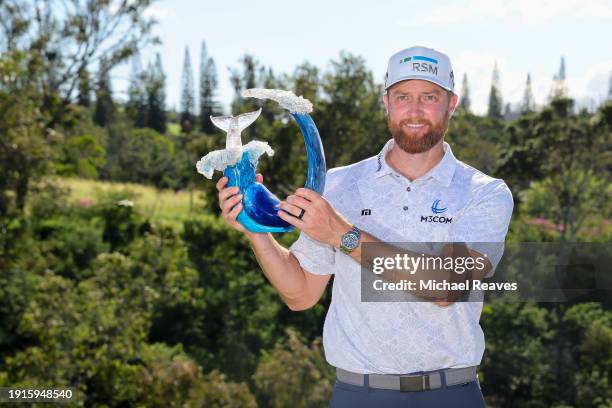 Chris Kirk of the United States celebrates with the trophy after winning the final round of The Sentry at Plantation Course at Kapalua Golf Club on...