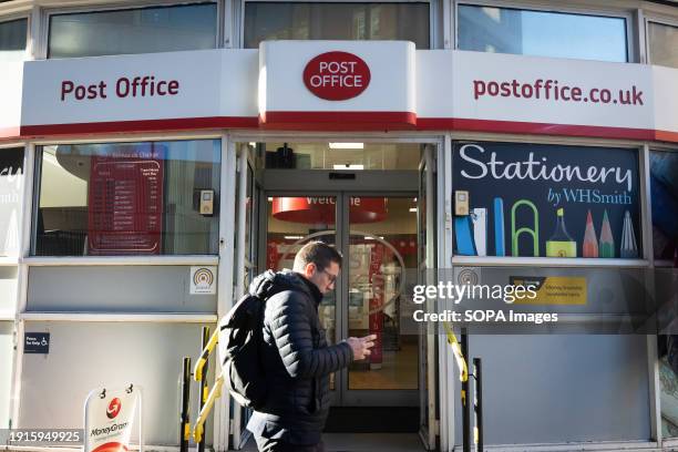 Man walks past a Post Office branch in Westminster, London. The British government has introduced a new law to absolve wrongly convicted...