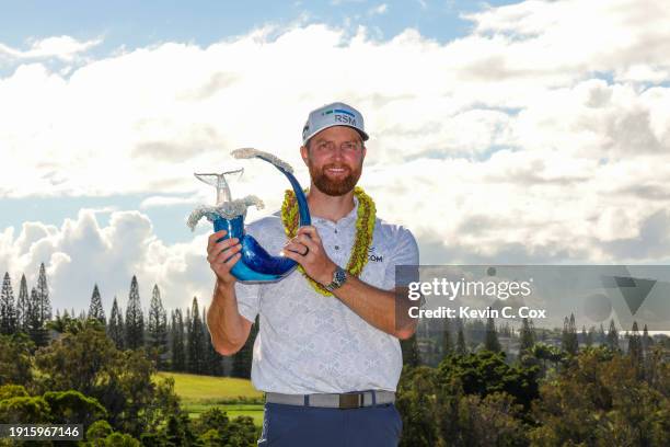 Chris Kirk of the United States celebrates with the trophy after winning the final round of The Sentry at Plantation Course at Kapalua Golf Club on...