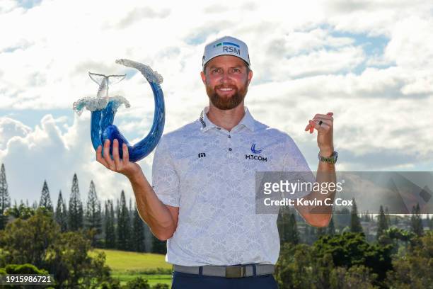 Chris Kirk of the United States celebrates with the trophy after winning the final round of The Sentry at Plantation Course at Kapalua Golf Club on...