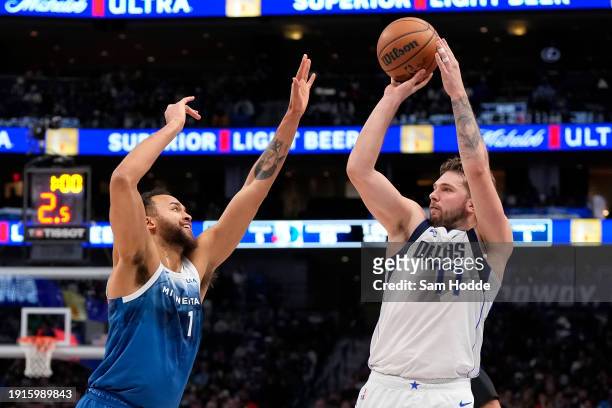 Luka Doncic of the Dallas Mavericks shoots as Kyle Anderson of the Minnesota Timberwolves defends at American Airlines Center on January 07, 2024 in...