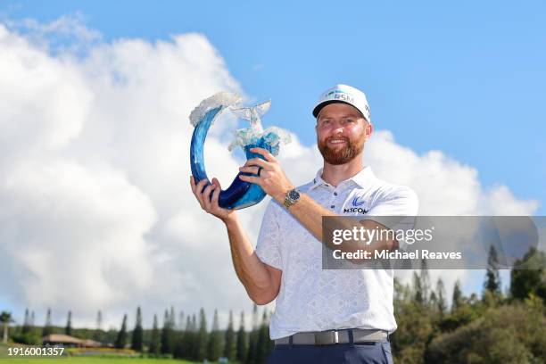 Chris Kirk of the United States celebrates with the trophy after winning the final round of The Sentry at Plantation Course at Kapalua Golf Club on...