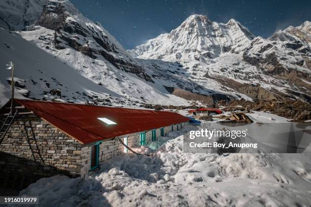 night landscape of annapurna south seen from annapurna base camp, nepal. - base camp stock pictures, royalty-free photos & images
