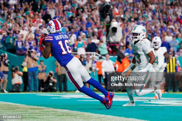 Trent Sherfield of the Buffalo Bills catches a touchdown pass during the second quarter against the Miami Dolphins at Hard Rock Stadium on January...