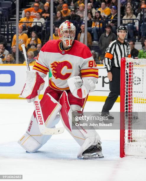 Dan Vladar of the Calgary Flames tends net against the Nashville Predators during an NHL game at Bridgestone Arena on January 4, 2024 in Nashville,...