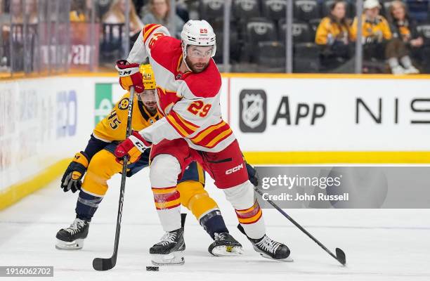 Dillon Dube of the Calgary Flames skates against the Nashville Predators during an NHL game at Bridgestone Arena on January 4, 2024 in Nashville,...