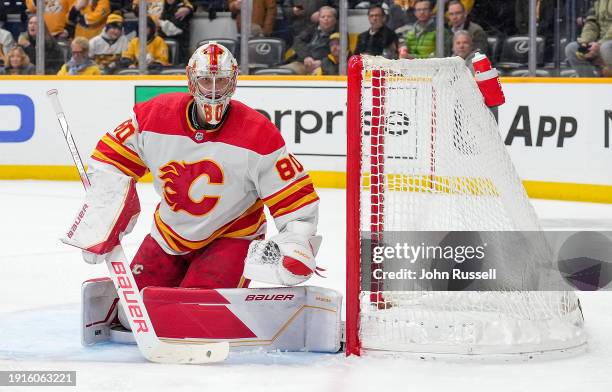 Dan Vladar of the Calgary Flames tends net against the Nashville Predators during an NHL game at Bridgestone Arena on January 4, 2024 in Nashville,...