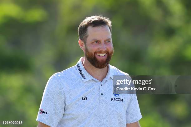 Chris Kirk of the United States celebrates after winning on the 18th green during the final round of The Sentry at Plantation Course at Kapalua Golf...