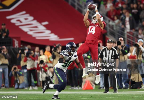 Michael Wilson of the Arizona Cardinals catches a 12-yard reception against Michael Jackson of the Seattle Seahawks during the fourth quarter of the...