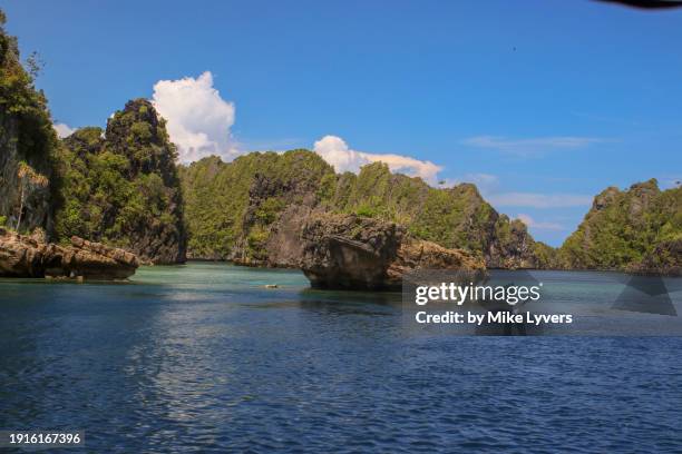 jagged karst islands of misool - misool island stock pictures, royalty-free photos & images