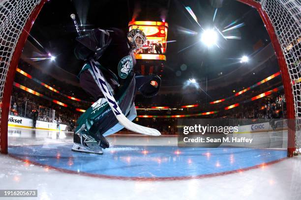 Lukas Dostal of the Anaheim Ducks prepares the crease prior to a game against the Detroit Red Wings during the third period of a game at Honda Center...