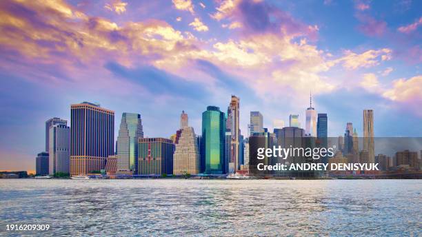 new york city, manhattan skyline at sunset - new york skyline stock pictures, royalty-free photos & images
