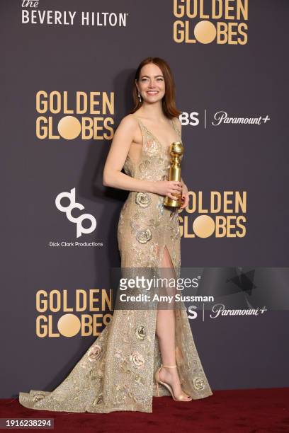 Emma Stone, winner of the Best Performance by an Actress in a Motion Picture, Musical or Comedy award for "Poor Things" poses in the press room...