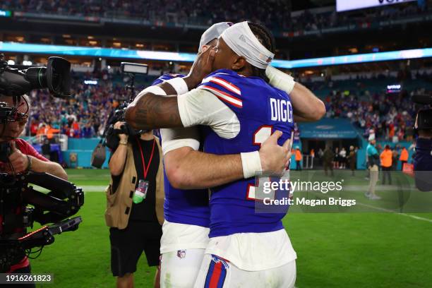 Stefon Diggs of the Buffalo Bills and Josh Allen react after a 21-14 victory against the Miami Dolphins at Hard Rock Stadium on January 07, 2024 in...