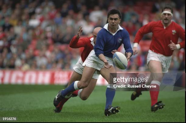 Richie Collins of Wales chases after Stephen Bachop of Western Samoa as he receives the ball in the quarter finals of the 1991 Rugby Union World Cup...