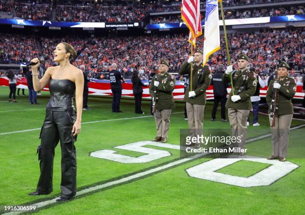 Katharine McPhee sings the United States national anthem before a game between the Denver Broncos and the Las Vegas Raiders at Allegiant Stadium on...