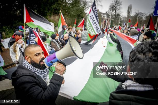 Palestinian sympathizers take part in a demonstration during a hearing at the International Court of Justice on a genocide complaint by South Africa...