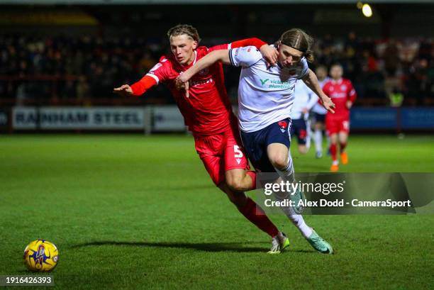 Bolton Wanderers' Jon Dadi Bodvarsson vies for possession with Accrington Stanley's Brad Hills during the Bristol Street Motors Trophy Third Round...