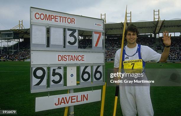 Jan Zelezny of Czechoslovakia standing by the score board after winning the Javelin event and achieving a New World Record of 95.66 Metres during the...