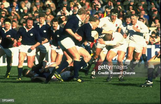 Derek White of Scotland charges at Dean Richards of England during the Five Nations Championship match at Murrayfield in Edinburgh, Scotland. England...