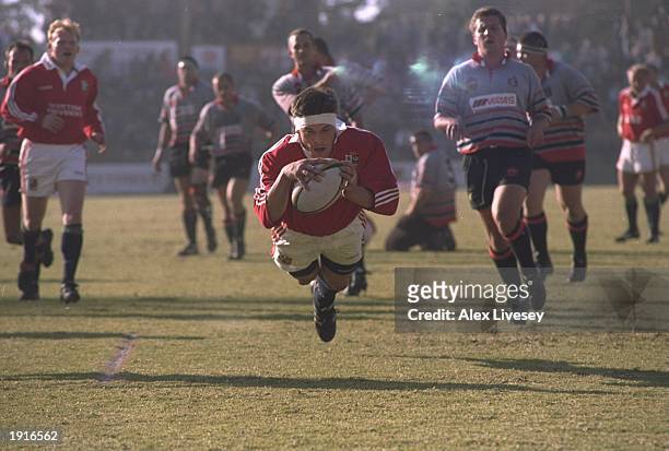 Rob Wainwright of the British Lions dives over the line to score a try during the tour match against Mpumalanga at the Jan van Riebeeck Stadium at...