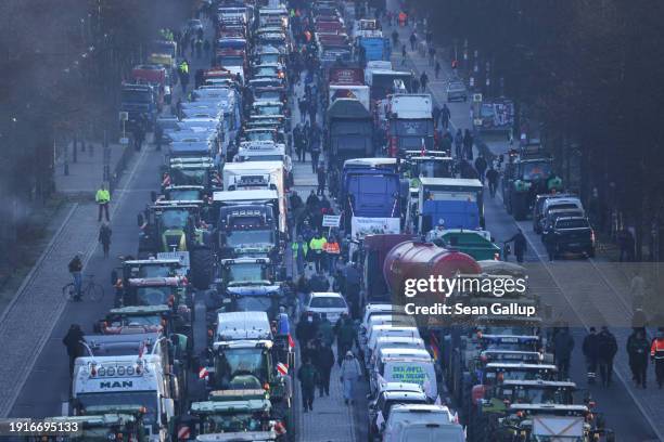 Protesting farmers and others line Strasse des 17. Juni street with tractors and other vehicles on the first day of a week of protests on January 08,...