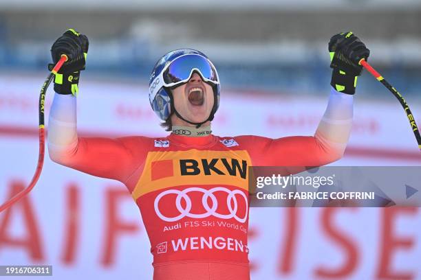 Switzerland's Marco Odermatt reacts at the finish line after competing in the Men's Downhill race at the FIS Alpine Skiing World Cup event in Wengen,...