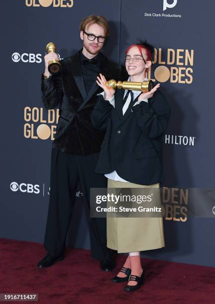 And Billie Eilish poses in the press room during the 81st Annual Golden Globe Awards at The Beverly Hilton on January 7, 2024 in Beverly Hills,...